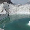The ice at this lake is only little polluted with debris. But especially at its south part the Engilchek Glacier is covered in dirty gray moraine as a result of its millennia of churning its way through rock and ice.
